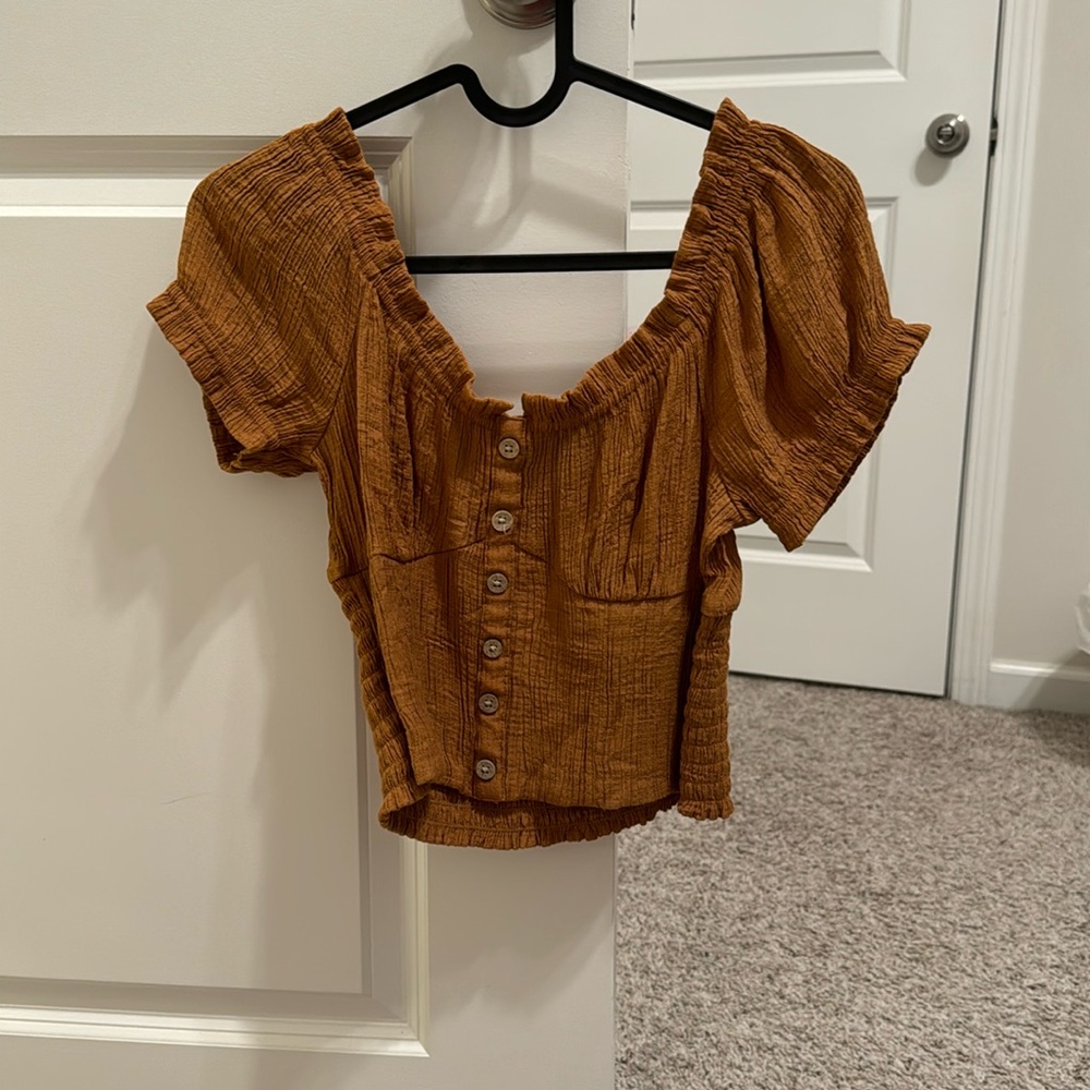 Small sized tan crop top